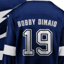 a blue jersey with the name bobby dimao on it