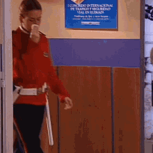 a woman in a red uniform is standing in front of a sign that says congreso internacional de trafico y seguridad