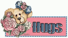 a picture of a teddy bear with roses and the words hugs