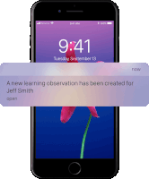 a phone with a notification that says a new learning observation has been created for jeff smith open