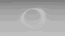 a gray background with a white circle in the middle of it