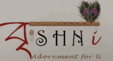 a logo for ashni adornment for u with a peacock feather on a flute