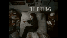 a person laying on a bed with the words " the reeling " on the bottom