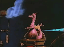 a pink cartoon dragon is sitting on top of a fire truck with smoke coming out of it .