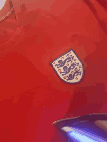 a red shirt with a badge that says england