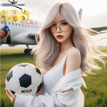 a woman is holding a soccer ball in front of an airplane with the words museum bola on it