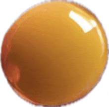 a close up of a yellow ball with a white background .