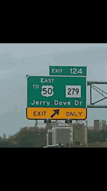 a highway sign that says exit 124 to east 50