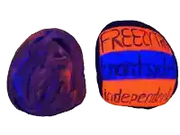 a purple ball with the word free on it next to an orange ball with the word independent