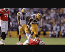 a football player with the number 43 on his jersey is laying on the field