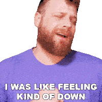 a man with a beard is wearing a purple shirt and says " i was like feeling kind of down "