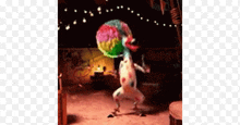 a frog is holding a colorful ball on its head and dancing .