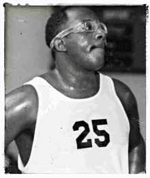 a man wearing glasses and a number 25 jersey