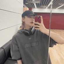 a person taking a selfie in front of a mirror