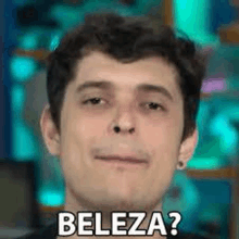 a close up of a man 's face with the word beleza written on it .