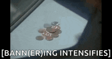 a bunch of coins are laying on a table with the words `` banner ing intensifies '' written on the bottom .