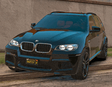 a black bmw with a license plate that says bn855fsw