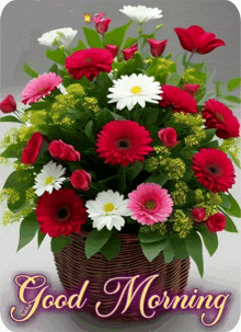 a bouquet of flowers in a wicker basket with the words good morning