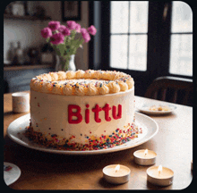 a cake with the word bittu on it