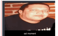 a picture of a man in a black shirt with the words sal moment on the bottom