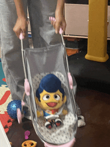 a person is pushing a stroller with a stuffed toy in it