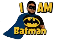 a man with a cape and a batman t-shirt says i am batman