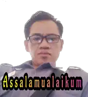 a man wearing glasses and a shirt that says assalamualaikum on it