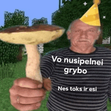 a man in a party hat is holding a large mushroom .