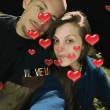 a man and a woman are posing for a picture and the man is wearing a shirt that says i love you