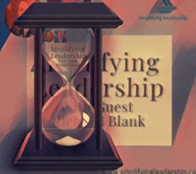 an hourglass with the words ' amplifying leadership ' on it