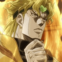 a close up of dio from jojo 's bizarre adventure holding his hands together in front of a fire background .