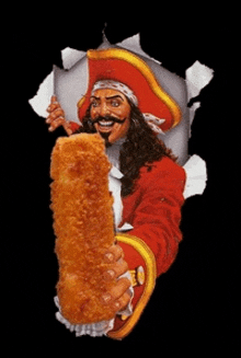 a man in a pirate costume is holding a large chicken stick