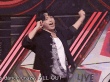 a man in a black jacket is dancing with the words " dance crazy all out " written below him