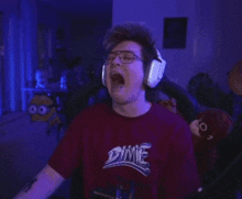 a man wearing headphones and a red shirt is screaming in a video game .