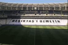 a soccer field with a banner that says vodafone park