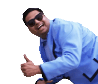 a man wearing sunglasses and a blue suit is giving a thumbs up