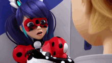 a ladybug cartoon character is talking to a boy