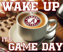 a cup of coffee with the logo for alabama football