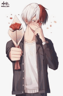 a boy is holding a rose in his hand .