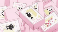 a bunch of pink boxes with pandas in them