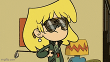 a cartoon of a girl wearing sunglasses and holding a golf club .