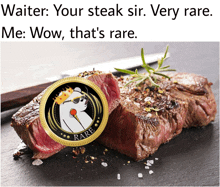 a steak with a coin that says " rare " on it