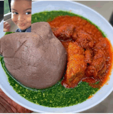 a plate of food with a child 's face in the background