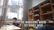 a young boy is sitting at a desk in a classroom in front of a window and a bookshelf .