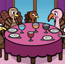 a group of turkeys are sitting around a table with plates and glasses of wine