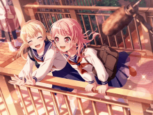 two girls in school uniforms are standing on a balcony and smiling