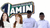 a group of people standing in front of a sign that says ' amin '