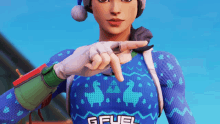 a woman wearing a sweater that says gfuel is pointing at something