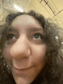 a close up of a girl 's face with a big nose