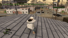 a screenshot of a video game shows a man standing on a roof talking on a phone